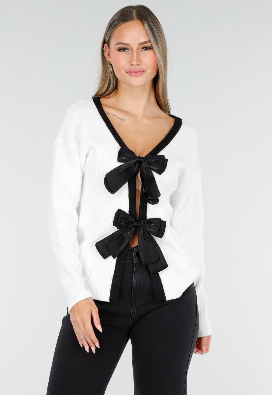 Witte Cardigan met Zwarte Strikken en Lange Mouwen