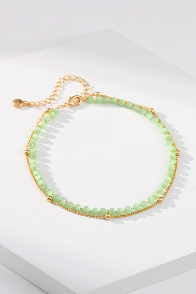 NEW080726 Goudkleurige Enkelband met Groene Kralen en Fijne Schakel